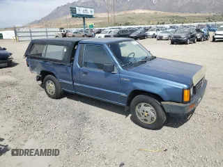 1989 Mitsubishi Mighty Max z VIN JA7FL24D7KP055207, wystawiony jako Copart lot #53172405 z przebiegiem 118 439 mil mil oraz Szkoda całkowita • Salvage title. Historia ofert i sprzedaży dostępna na DreamBid. Obrazek 4.