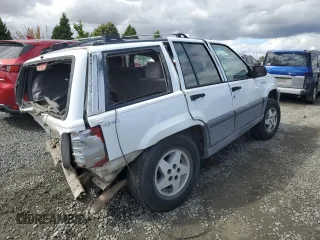 1994 Jeep Grand Cherokee Laredo with VIN 1J4GZ58Y2RC207099, listed as a Copart auction lot 71176114 with 127,110 mi miles and Salvage Title. Bid and sale history available at carsss.com. Image 3.