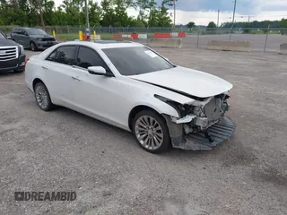 2018 Cadillac CTS Luxury AWD z VIN 1G6AX5SX1J0138559, wystawiony jako IAAI lot #42545450 z przebiegiem 78 185 mil mil oraz . Historia ofert i sprzedaży dostępna na DreamBid. Obrazek 1.