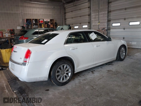 2014 Chrysler 300 with VIN 2C3CCAAGXEH217715, listed as a IAAI auction lot 41666179 with 145,744 mi miles and . Bid and sale history available at DreamBid. Image 4.