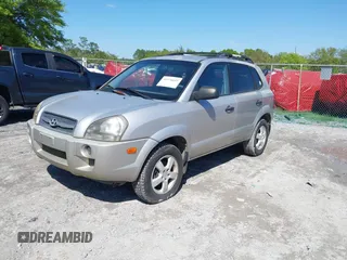 2006 Hyundai Tucson GL with VIN KM8JM12BX6U249982, listed as a IAAI auction lot 41976033 with 107,153 mi miles. Bid and sale history available at carsss.com. Image 2.