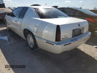 2000 Cadillac Eldorado z VIN 1G6EL12Y0YB704658, wystawiony jako Copart lot #77596814 z przebiegiem Nie podano mil oraz Nie do naprawy • Non repairable. Historia ofert i sprzedaży dostępna na DreamBid. Obrazek 2.