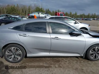 2018 Honda Civic EX-T z VIN 2HGFC1F34JH641837, wystawiony jako IAAI lot #41858089 z przebiegiem 65 318 mil mil oraz . Historia ofert i sprzedaży dostępna na DreamBid. Obrazek 13.