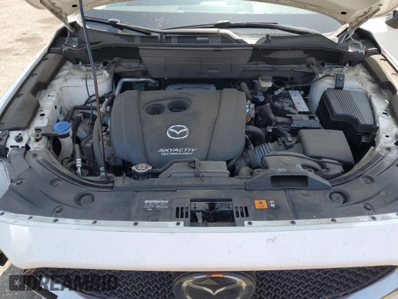 2018 Mazda CX-5 Grand Touring z VIN JM3KFADM3J1464073, wystawiony jako Copart lot #59571385 z przebiegiem Nie podano mil oraz Szkoda całkowita • Salvage title. Historia ofert i sprzedaży dostępna na DreamBid. Obrazek 12.