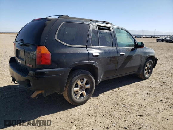 2002 GMC Envoy SLT with VIN 1GKDT13S022107749, listed as a Copart auction lot 59548544 with 221,224 mi miles and Clean Title. Bid and sale history available at DreamBid. Image 3.
