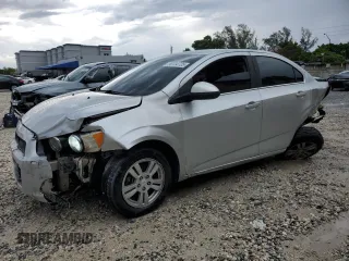2015 Chevrolet Sonic LT with VIN 1G1JC5SH4F4142180, listed as a Copart auction lot 59134725 with 129,699 mi miles and Salvage title. Bid and sale history available at DreamBid. Image 1.