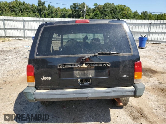 1998 Jeep Cherokee Sport with VIN 1J4FT68S9WL141631, listed as a Copart auction lot 68974974 with 0 mi miles and Salvage Title. Bid and sale history available at carsss.com. Image 6.