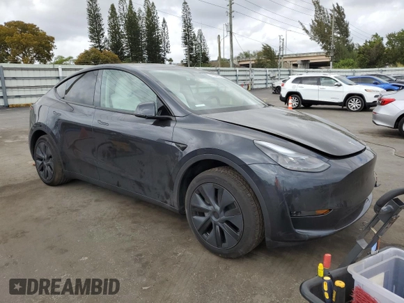 2025 Tesla Model Y Long Range with VIN 7SAYGDED6SF228626, listed as a Copart auction lot 47654525 with 2,087 mi miles and Salvage Title. Bid and sale history available at DreamBid. Image 4.