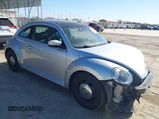2013 Volkswagen Beetle 2.5L w/Sun/Sound/Nav with VIN 3VWJX7AT3DM663774, listed as a IAAI auction lot 41738146 with 98,064 mi miles and . Bid and sale history available at DreamBid. Image 1.