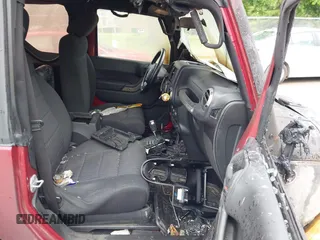 2012 Jeep Wrangler Sport with VIN 1C4AJWAG9CL203018, listed as a IAAI auction lot 42377899 with Not provided miles and . Bid and sale history available at DreamBid. Image 5.