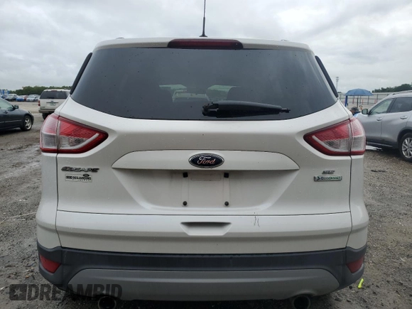 2013 Ford Escape SE with VIN 1FMCU0GX3DUB86597, listed as a Copart auction lot 59513935 with 94,293 mi miles and Salvage title. Bid and sale history available at DreamBid. Image 6.