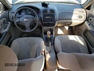 2003 Mazda Protege DX with VIN JM1BJ226231214537, listed as a Copart auction lot 54448615 with 147,753 mi miles and Salvage Title. Bid and sale history available at DreamBid. Image 8.