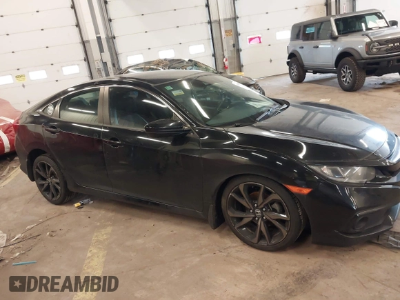 2019 Honda Civic Sport with VIN 19XFC2F89KE206213, listed as a IAAI auction lot 41804863 with 76,052 mi miles and . Bid and sale history available at DreamBid. Image 14.
