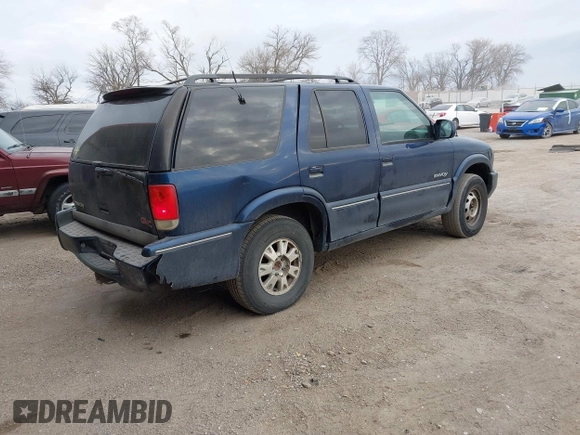 2000 GMC Jimmy SLE Convenience z VIN 1GKDT13W8Y2340743, wystawiony jako IAAI lot #41393906 z przebiegiem 196 520 mil mil oraz . Historia ofert i sprzedaży dostępna na DreamBid. Obrazek 4.
