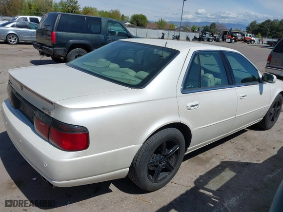 2003 Cadillac Seville Touring STS with VIN 1G6KY54963U110607, listed as a IAAI auction lot 42080691 with 79,605 mi miles. Bid and sale history available at carsss.com. Image 4.