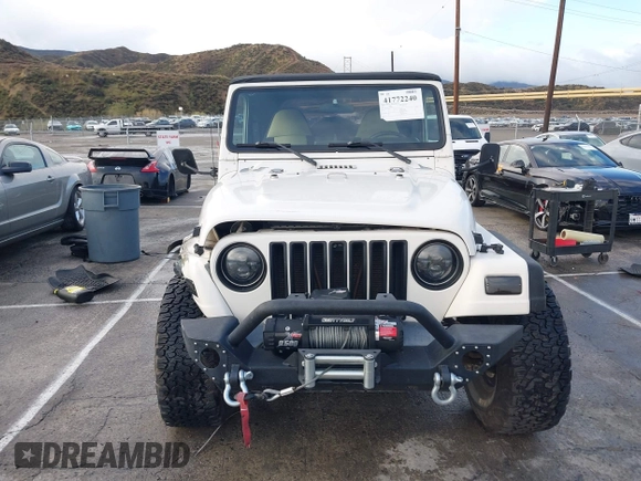 2001 Jeep Wrangler Sport with VIN 1J4FA49S41P308407, listed as a IAAI auction lot 41772240 with 139,461 mi miles. Bid and sale history available at carsss.com. Image 12.