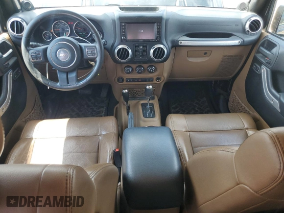 2012 Jeep Wrangler Unlimited Sahara z VIN 1C4HJWEG6CL141988, wystawiony jako Copart lot #61631115 z przebiegiem 140 401 mil mil oraz Szkoda całkowita • Salvage title. Historia ofert i sprzedaży dostępna na DreamBid. Obrazek 8.