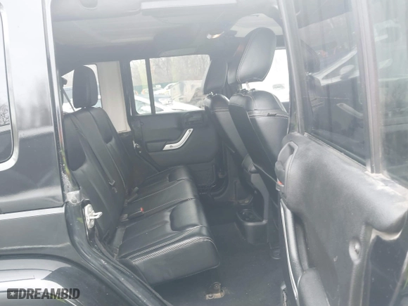 2015 Jeep Wrangler Unlimited Rubicon Hard Rock with VIN 1C4HJWFG9FL569962, listed as a IAAI auction lot 41557801 with 78,597 mi miles. Bid and sale history available at carsss.com. Image 8.