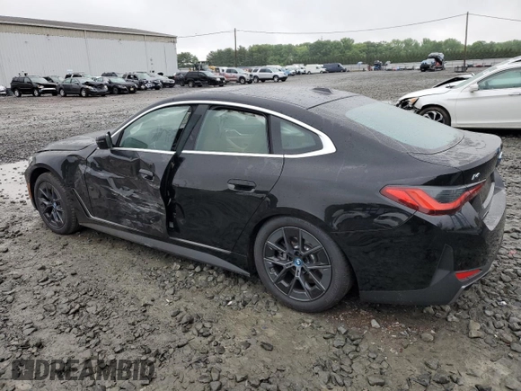 2024 BMW i4 eDrive35 with VIN WBY43AW05RFS84773, listed as a Copart auction lot 54974024 with 2,942 mi miles and Salvage Title. Bid and sale history available at carsss.com. Image 2.
