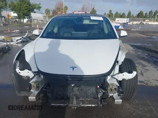 2021 Tesla Model 3 Long Range with VIN 5YJ3E1EB9MF055990, listed as a IAAI auction lot 41584065 with 49,147 mi miles and . Bid and sale history available at carsss.com. Image 13.
