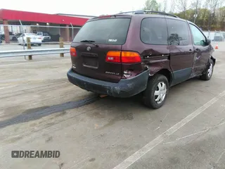 2000 Toyota Sienna LE with VIN 4T3ZF13C8YU209477, listed as a IAAI auction lot 41952970 with 293,084 mi miles. Bid and sale history available at carsss.com. Image 4.