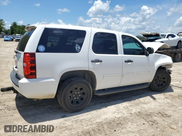 2014 Chevrolet Tahoe Commercial with VIN 1GNLC2E04ER202441, listed as a Copart auction lot 61310725 with 117,443 mi miles and Salvage title. Bid and sale history available at DreamBid. Image 3.