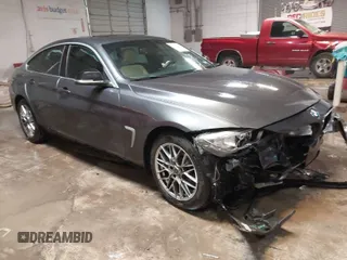 2015 BMW 4 Series 435i xDrive z VIN WBA4B3C52FG343958, wystawiony jako IAAI lot #41294970 z przebiegiem 110 319 mil mil oraz . Historia ofert i sprzedaży dostępna na DreamBid. Obrazek 1.