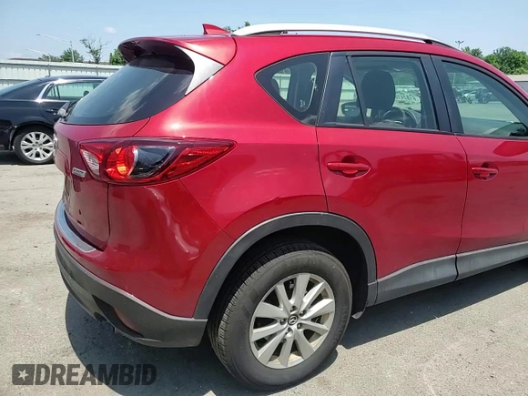 2016 Mazda CX-5 Sport with VIN JM3KE4BY3G0765905, listed as a Copart auction lot 61874165 with 134,546 mi miles and Salvage title. Bid and sale history available at DreamBid. Image 14.