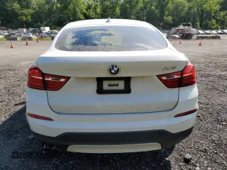 2015 BMW X4 xDrive28i with VIN 5UXXW3C51F0M89005, listed as a Copart auction lot 57392984 with 142,385 mi miles. Bid and sale history available at carsss.com. Image 6.