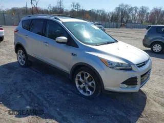 2014 Ford Escape Titanium with VIN 1FMCU9JX2EUB31752, listed as a IAAI auction lot 41948821 with 147,565 mi miles. Bid and sale history available at carsss.com. Image 1.
