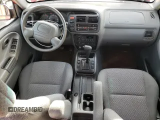 2003 Chevrolet Tracker z VIN 2CNBE13CX36943395, wystawiony jako Copart lot #70964574 z przebiegiem 118 975 mil mil oraz Szkody całkowita. Historia ofert i sprzedaży dostępna na DreamBid. Obrazek 8.