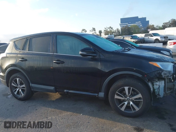2018 Toyota RAV4 XLE with VIN 2T3WFREV2JW483635, listed as a IAAI auction lot 41856177 with 94,710 mi miles. Bid and sale history available at carsss.com. Image 14.
