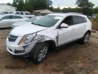 2012 Cadillac SRX Performance Collection z VIN 3GYFNBE32CS653172, wystawiony jako IAAI lot #42287435 z przebiegiem 161 065 mil mil oraz . Historia ofert i sprzedaży dostępna na DreamBid. Obrazek 2.