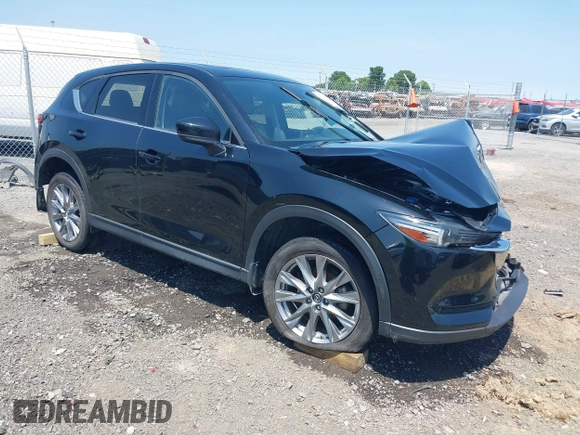 2020 Mazda CX-5 Grand Touring with VIN JM3KFADM9L1837183, listed as a IAAI auction lot 42340628 with 81,975 mi miles and . Bid and sale history available at DreamBid. Image 1.