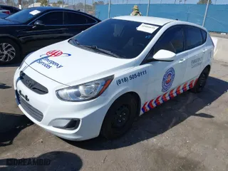 2012 Hyundai Accent GS with VIN KMHCT5AEXCU051493, listed as a IAAI auction lot 41666634 with 176,293 mi miles. Bid and sale history available at carsss.com. Image 2.