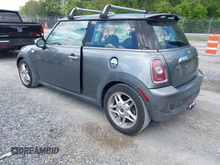 2009 MINI Hardtop S with VIN WMWMF73549TX41034, listed as a IAAI auction lot 42210662 with 108,118 mi miles and . Bid and sale history available at DreamBid. Image 3.