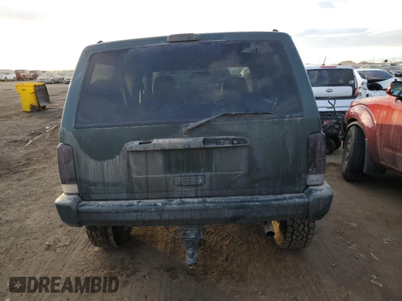 1997 Jeep Cherokee Country with VIN 1J4FJ78SXVL566804, listed as a Copart auction lot 88557395 with 216,230 mi miles and Salvage title. Bid and sale history available at DreamBid. Image 6.