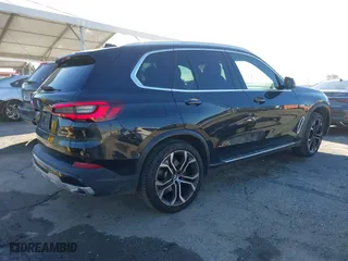 2023 BMW X5 sDrive40i with VIN 5UXCR4C00P9P46054, listed as a IAAI auction lot 41627025 with 20,152 mi miles. Bid and sale history available at carsss.com. Image 4.