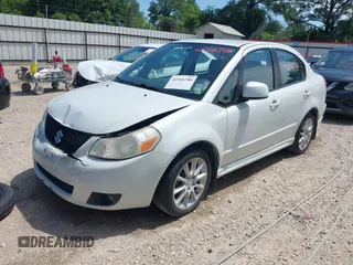2008 Suzuki SX4 Touring 2 z VIN JS2YC417285100960, wystawiony jako IAAI lot #42166346 z przebiegiem 162 498 mil mil oraz . Historia ofert i sprzedaży dostępna na DreamBid. Obrazek 2.