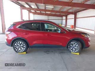 2020 Ford Escape Titanium Hybrid z VIN 1FMCU9DZ1LUC19346, wystawiony jako IAAI lot #41597142 z przebiegiem 75 945 mil mil oraz . Historia ofert i sprzedaży dostępna na DreamBid. Obrazek 13.