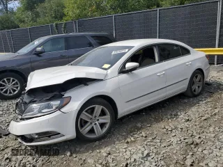 2014 Volkswagen CC Sport with VIN WVWBN7AN3EE528302, listed as a Copart auction lot 69636034 with 77,332 mi miles and Salvage Title. Bid and sale history available at DreamBid. Image 1.