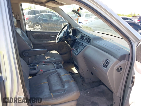 2002 Honda Odyssey EX-L z VIN 5FNRL18062B011890, wystawiony jako IAAI lot #41972294 z przebiegiem 245 889 mil mil oraz . Historia ofert i sprzedaży dostępna na DreamBid. Obrazek 5.