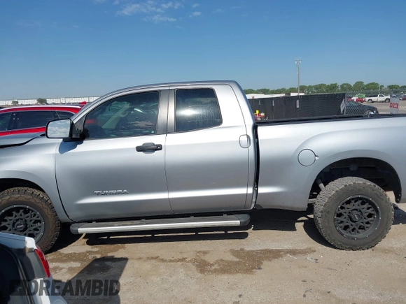 2011 Toyota Tundra with VIN 5TFRM5F18BX033833, listed as a IAAI auction lot 42257200 with 108,046 mi miles and . Bid and sale history available at DreamBid. Image 14.