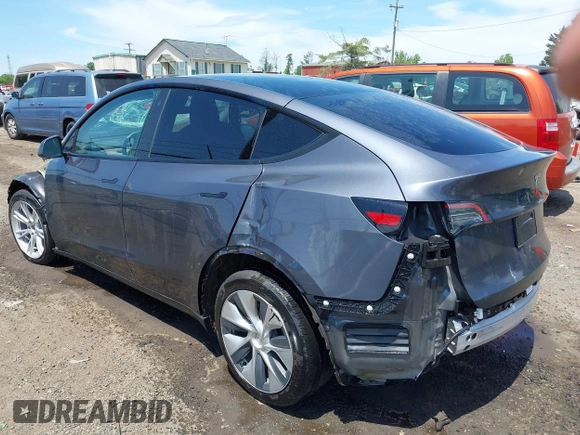 2023 Tesla Model Y Long Range with VIN 7SAYGAEE7PF615751, listed as a IAAI auction lot 42297819 with 31,201 mi miles and . Bid and sale history available at DreamBid. Image 3.