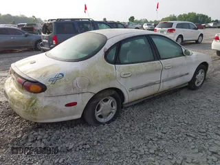 1997 Ford Taurus GL z VIN 1FALP52UXVA107778, wystawiony jako IAAI lot #42069491 z przebiegiem 57 736 mil mil oraz . Historia ofert i sprzedaży dostępna na DreamBid. Obrazek 4.