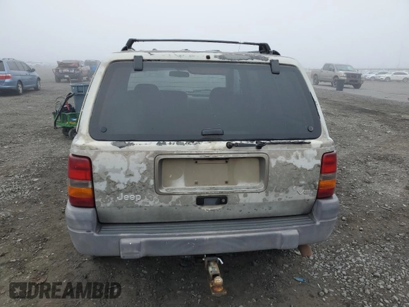1997 Jeep Grand Cherokee Laredo with VIN 1J4GZ58Y5VC637350, listed as a Copart auction lot 77405444 with 182,482 mi miles and Clean Title. Bid and sale history available at carsss.com. Image 6.