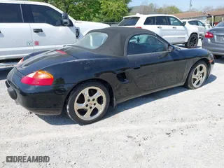 1999 Porsche Boxster with VIN WP0CA2980XU624284, listed as a IAAI auction lot 42058935 with 79,497 mi miles. Bid and sale history available at carsss.com. Image 4.