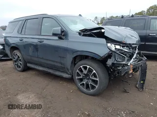 2021 Chevrolet Tahoe RST z VIN 1GNSKRKD8MR336351, wystawiony jako IAAI lot #41639553 z przebiegiem 35 310 mil mil oraz . Historia ofert i sprzedaży dostępna na DreamBid. Obrazek 1.