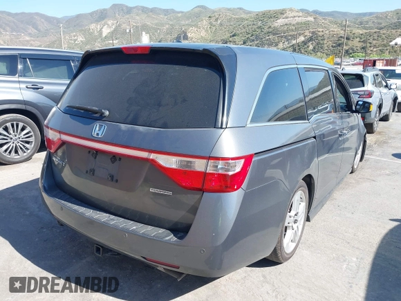 2011 Honda Odyssey Touring with VIN 5FNRL5H96BB009580, listed as a IAAI auction lot 42202595 with Not provided miles and . Bid and sale history available at DreamBid. Image 4.