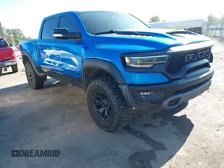 2021 Ram 1500 TRX z VIN 1C6SRFU91MN900450, wystawiony jako IAAI lot #42102724 z przebiegiem 80 071 mil mil oraz . Historia ofert i sprzedaży dostępna na DreamBid. Obrazek 1.